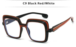 Detailed side view of square multi-layer black and red frame glasses with clear lenses