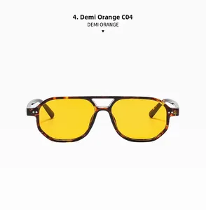 Detail of demi orange pilot sunglasses featuring double bridge and amber tinted lenses