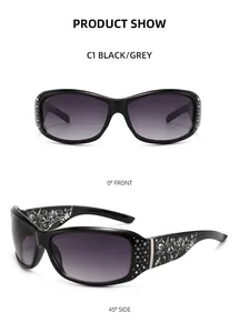 Detailed view of black sunglasses featuring rhinestone floral accents and grey gradient lenses