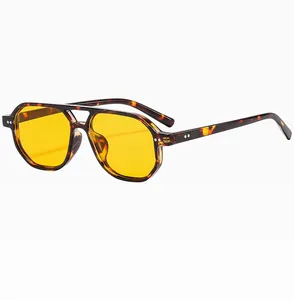 Close-up of tortoise aviator sunglasses with yellow lenses and double bridge detail