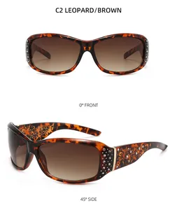 Detail view of leopard print sunglasses with rhinestone accents and gradient brown lenses