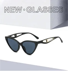 Detailed view of cat eye sunglasses featuring hollow temples with gold rings and white pearl