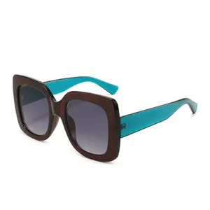 Retro square bicolor sunglasses with brown frames and turquoise blue temples for women