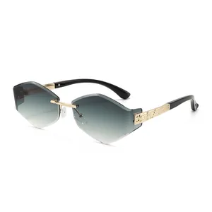 Frameless geometric shield sunglasses with gold metal temples and grey gradient lenses
