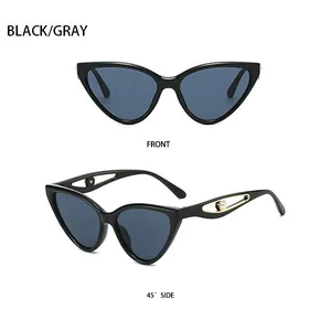 Cat eye sunglasses detail with hollow temples and pearl accents on black frames