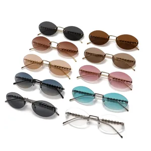 Modische randlose ovale Sonnenbrille mit perlenbesetzten Metallbügeln in neun Farben