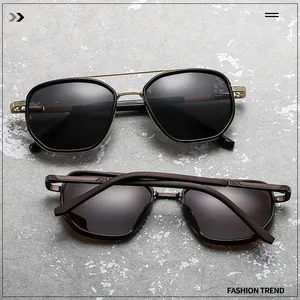 Close-up of retro aviator metal sunglasses with engraved bridge and tortoiseshell texture