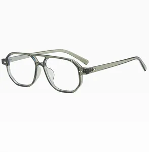 Detailed close-up of olive green double-bridge aviator frames with silver rivet accents
