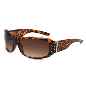 Fashionable tortoise shell sunglasses with diamond inlay and gold floral pattern temples