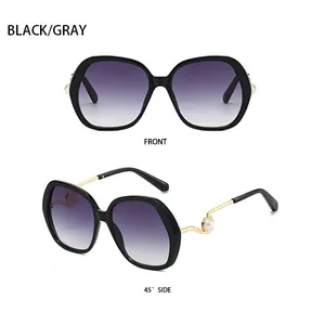Front and side view of black oversized sunglasses with pearl gold metal temples