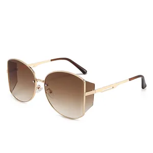 Stylische goldene Metall-Sonnenbrille mit braunen Verlaufsgläsern und Seitendesign