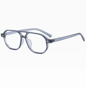 Detail view of transparent blue pilot sunglasses with double bridge and metal rivets