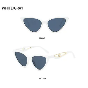 Detailed side view of white cat-eye sunglasses with gold hollow metal and pearl on temples