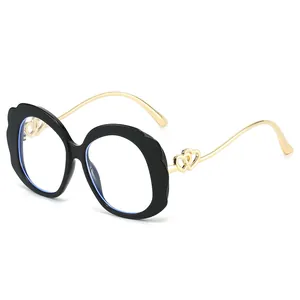 Fashion oval sunglasses with black wavy frame and gold double-heart metal temples