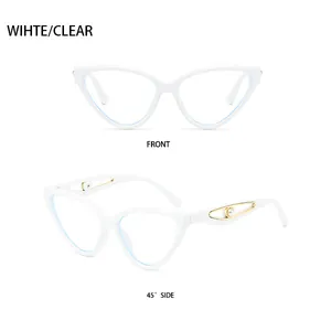 Macro view of white cat-eye sunglasses with gold hollow metal temples and pearl accents