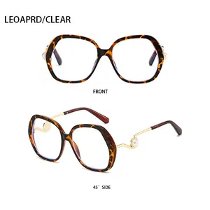 Detail of leopard print frames with golden twisted metal temples and pearl accents
