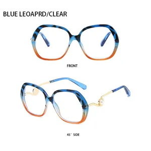 Detail of blue leopard gradient frames with gold metal temples and pearl accents