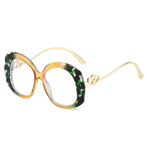 Fashion oval leopard print sunglasses with wavy frame and gold double heart metal temples