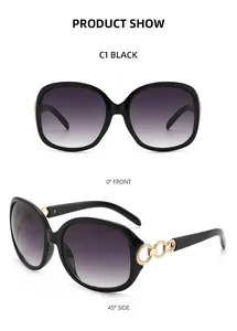 Vue avant et latérale de lunettes de soleil noires avec verres dégradés violets et chaîne d'or