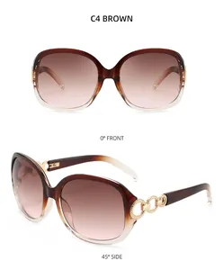 Détails des lunettes de soleil dégradé marron avec maillons de chaîne dorés élégants