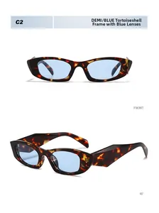 Détail de lunettes de soleil œil de chat rétro avec monture écaille et verres bleus vus