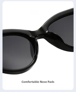 Close-up of comfortable integrated nose pads on black cat-eye sunglasses with glossy finish
