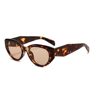 Chic cat eye sunglasses with leopard print frames and brown lenses in profile view