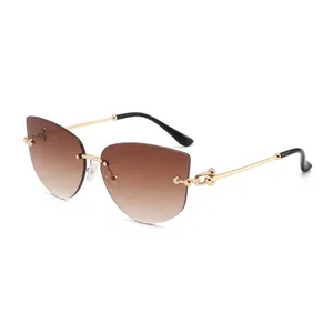 Chic rimless cat-eye sunglasses with gradient brown lenses and gold chain temples