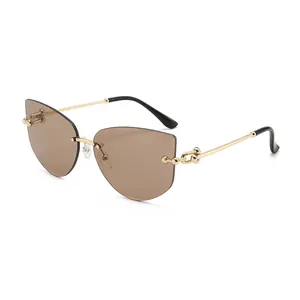 Chic rimless cat-eye sunglasses with gold metal frame and chain link temple detail