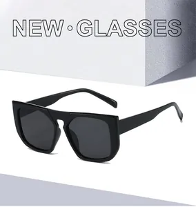 Macro view of thick black square frames and dark lenses of modern fashion sunglasses