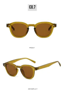 Front and side view of small round amber frame sunglasses with dark tea lenses