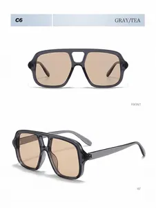 Close-up detail of gray aviator sunglasses with tea lenses and double bridge design.