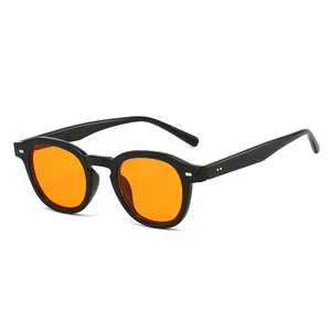 Retro small round black frame sunglasses with vibrant orange lenses for a trendy street look