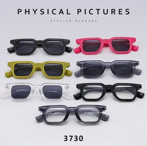 Flat lay of retro square sunglasses collection showing multiple colors and frame textures