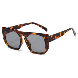 Fashionable oversized square tortoise shell sunglasses with gray lenses on white background