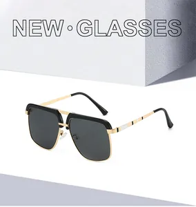 Detail of retro double-bridge sunglasses with black-gold metal frame and stripe temples