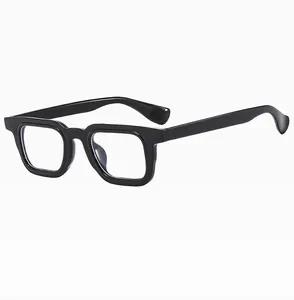 Detail view of glossy black square frames featuring a retro-style robust temple design
