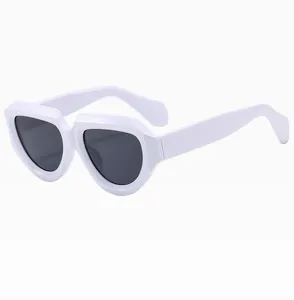 Detail shot of chunky white irregular frame sunglasses with dark black lenses