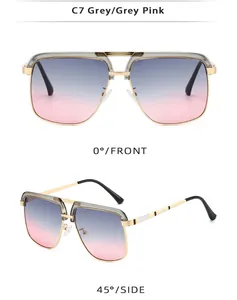 Detail of vintage navigator sunglasses with gold metal frame and blue-pink gradient lenses