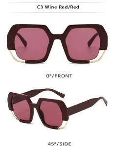 Detail view of wine red geometric sunglasses with gold metal wire accents and smooth finish