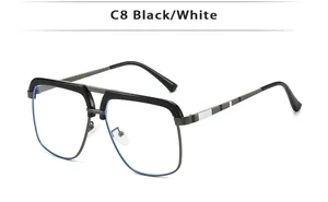 Detail view of double bridge retro metal aviator glasses with black and white stems