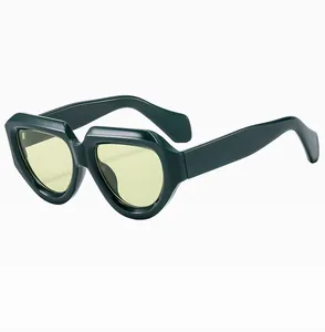 Detail of square frame sunglasses featuring dark green acetate and yellow lenses