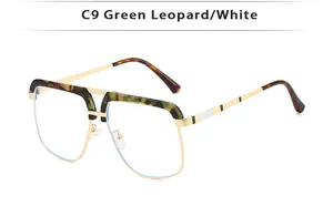 Detail of metal double bridge sunglasses with green leopard acetate accents on the frame