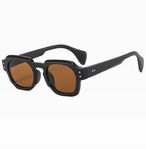 Close-up of retro square sunglasses featuring silver rivets and polished black frame