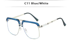 Close-up of blue and white striped temple detail on retro double-bridge metal sunglasses