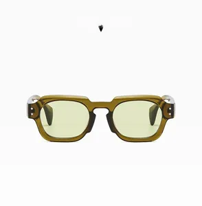 Close-up of olive green semi-transparent frame sunglasses with silver rivets and light green lens