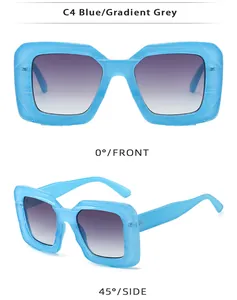 Detail view of square blue oversized sunglasses with gradient grey lenses in C4 color