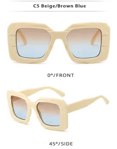 Detail of beige square oversized sunglasses with brown-blue gradient lenses and textured hinge