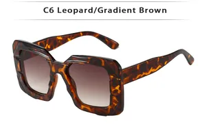 Detail of square leopard print sunglasses with gradient brown lenses and thick frames
