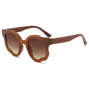 Brown irregular wavy frame sunglasses with gradient lenses for a stylish retro look